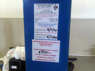 Service garage equipment and load sticker